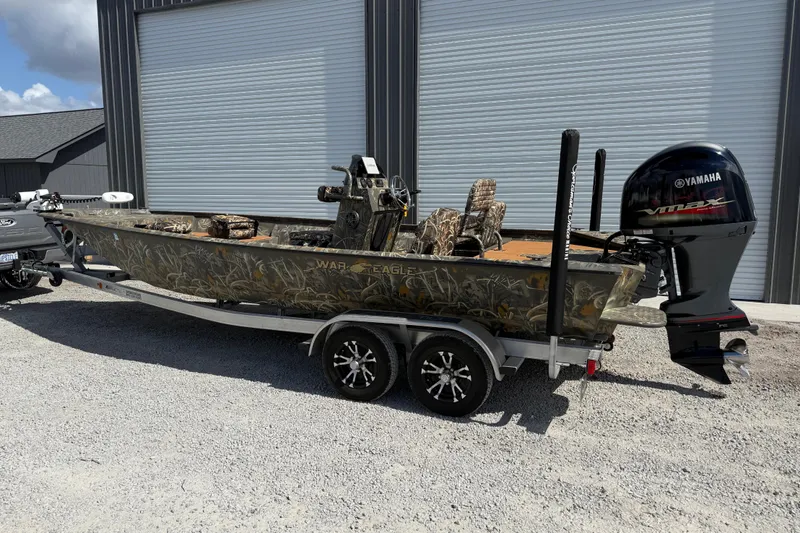 Slide: The Image of 2022 War Eagle 2170 Blackhawk boat with Yamaha VMAX engine on trailer. - 3
