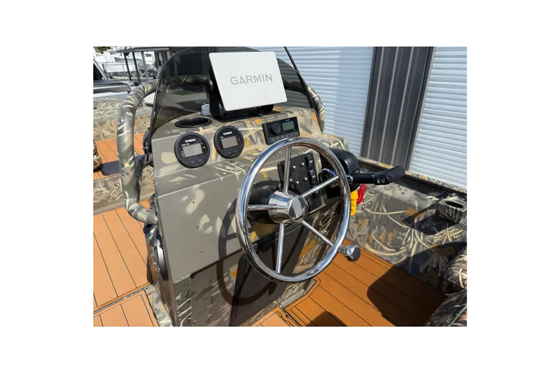 Slide: The Image of 2022 War Eagle 2170 Blackhawk boat console with Garmin navigation system. - 32
