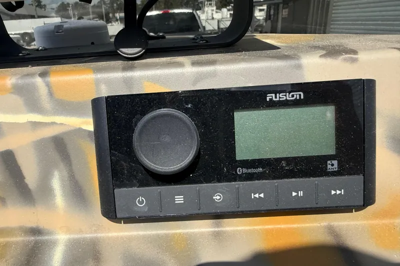 Slide: The Image of Fusion Bluetooth stereo system on 2022 War Eagle 2170 Blackhawk boat dashboard. - 34