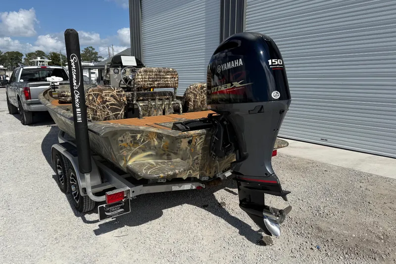 Slide: The Image of 2022 War Eagle 2170 Blackhawk boat with Yamaha 150 engine, camo seats, on trailer. - 5