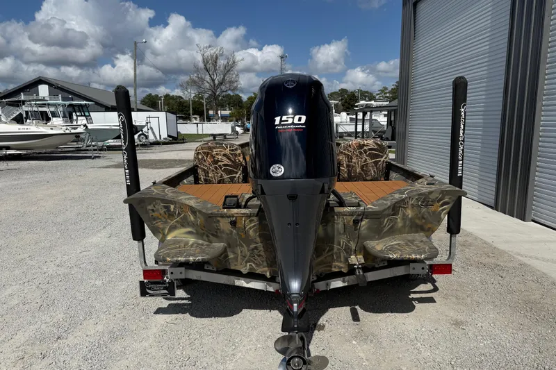 Slide: The Image of 2022 War Eagle 2170 Blackhawk boat with camo design and Yamaha 150 outboard motor. - 7