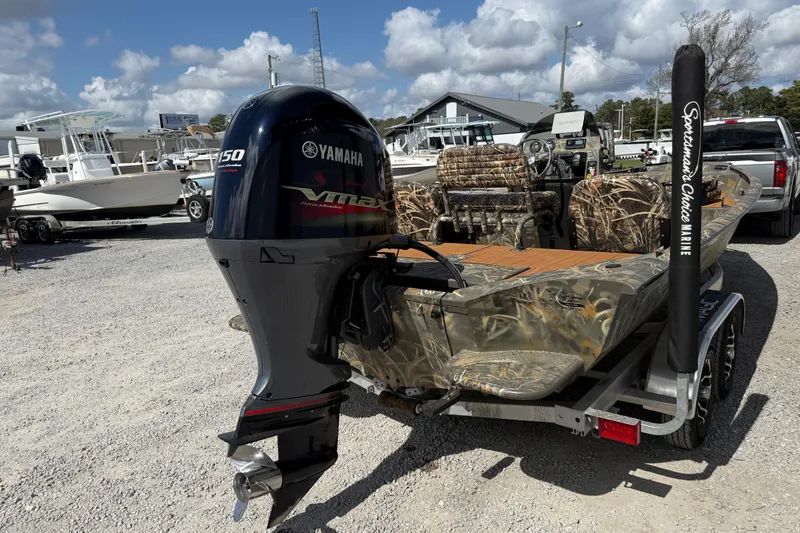 Slide: The Image of 2022 War Eagle 2170 Blackhawk boat with Yamaha VMAX engine, parked outdoors. - 9