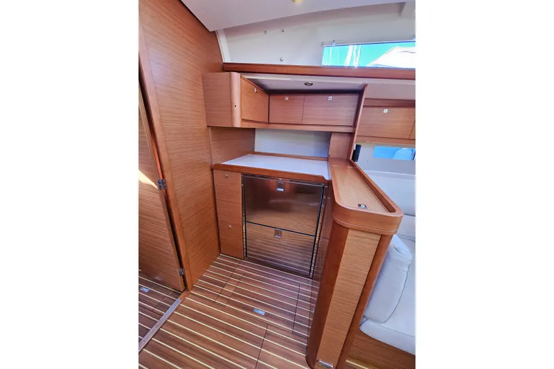 Slide: The Image of Interior of 2018 Dufour 460 Grand Large yacht with wooden cabinetry and flooring. - 13