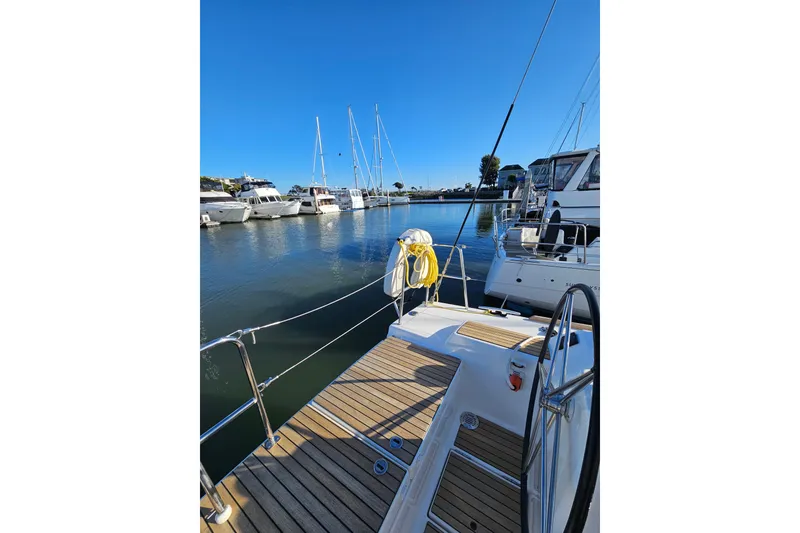 Slide: The Image of Dufour 460 Grand Large 2018 sailboat docked in a sunny marina. - 27
