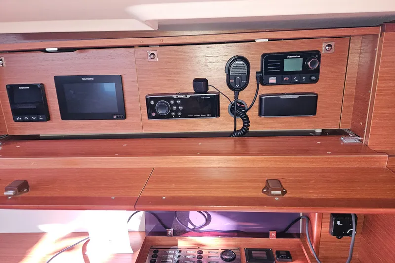 Slide: The Image of Control panel of a 2018 Dufour 460 Grand Large yacht with navigation equipment. - 34