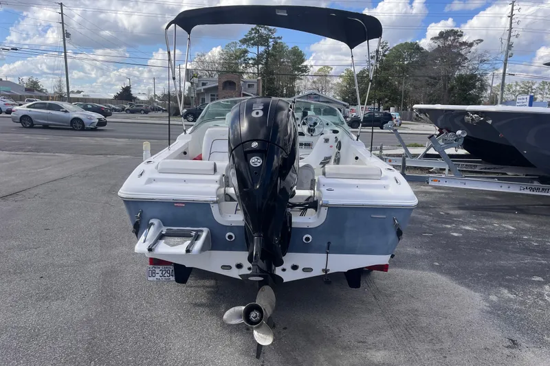 Slide: The Image of 2014 Tidewater 196 DC Explorer boat with outboard motor in parking lot. - 4