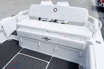 Slide: The Image of 2023 Fountain 34 Tournament Edition boat seating area with white upholstery. - 4