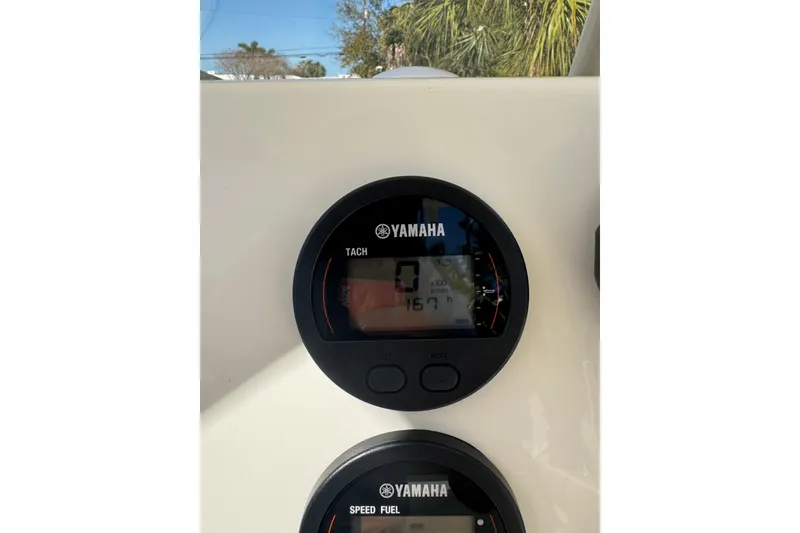 Slide: The Image of Yamaha tachometer on 2018 Key West 239 FS boat dashboard, displaying engine hours. - 10