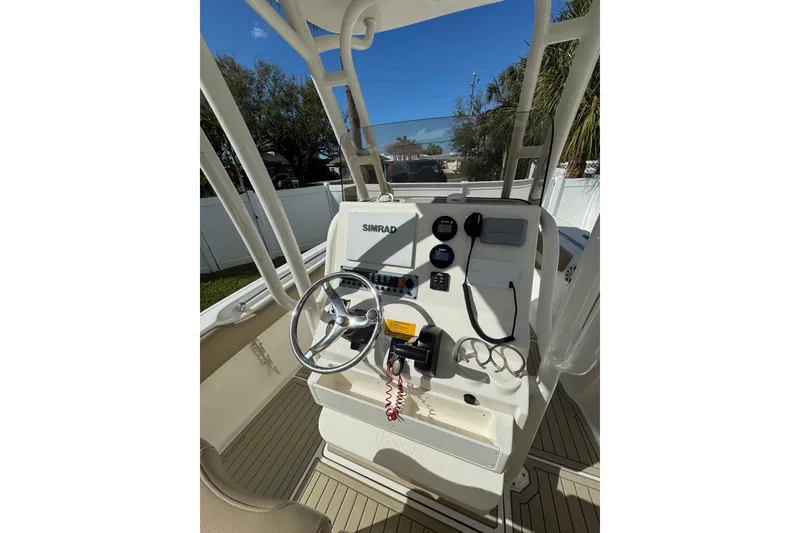 Slide: The Image of 2018 Key West 239 FS boat console with steering wheel and navigation equipment. - 5