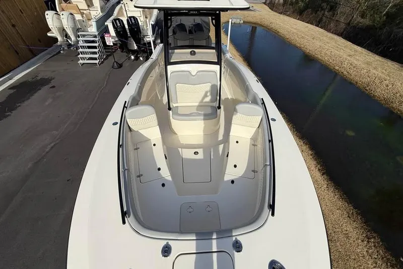 Slide: The Image of 2026 Scout 277 LXF boat, top view, showcasing spacious deck and seating area. - 3