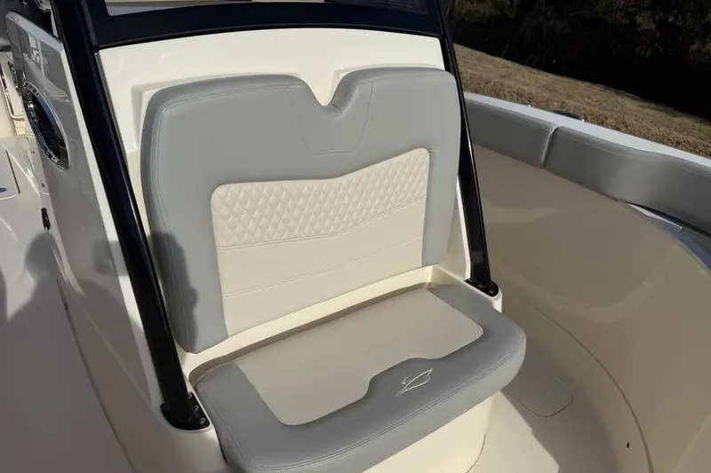 Slide: The Image of 2026 Scout 277 LXF boat seat with elegant gray and white upholstery design. - 8