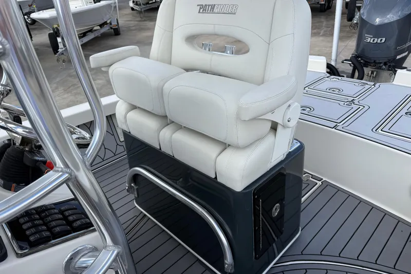 Slide: The Image of 2015 Pathfinder 2600 HPS boat with white captain's chair and Yamaha 300 engine. - 13