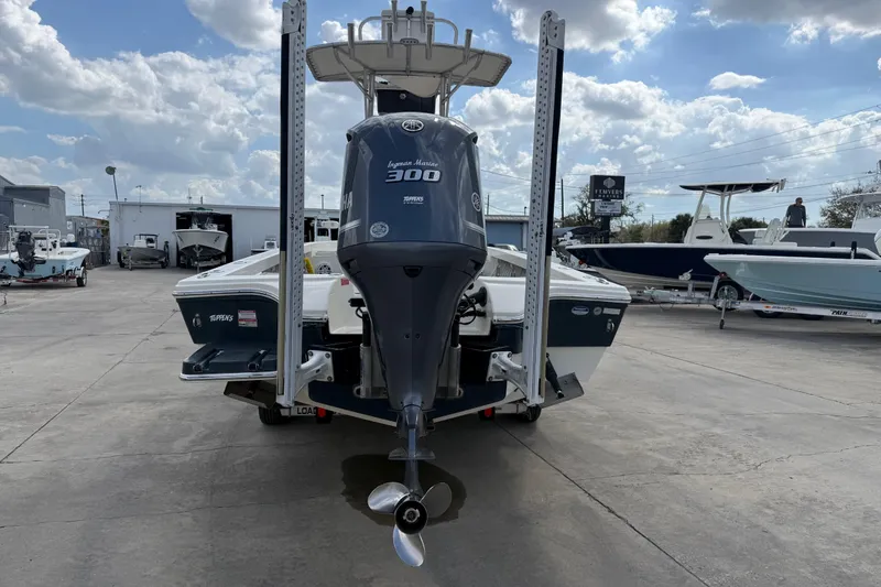 Slide: The Image of 2015 Pathfinder 2600 HPS boat with Yamaha engine in a marina setting. - 4