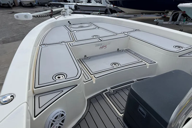 Slide: The Image of 2015 Pathfinder 2600 HPS boat deck with storage compartments and seating. - 9