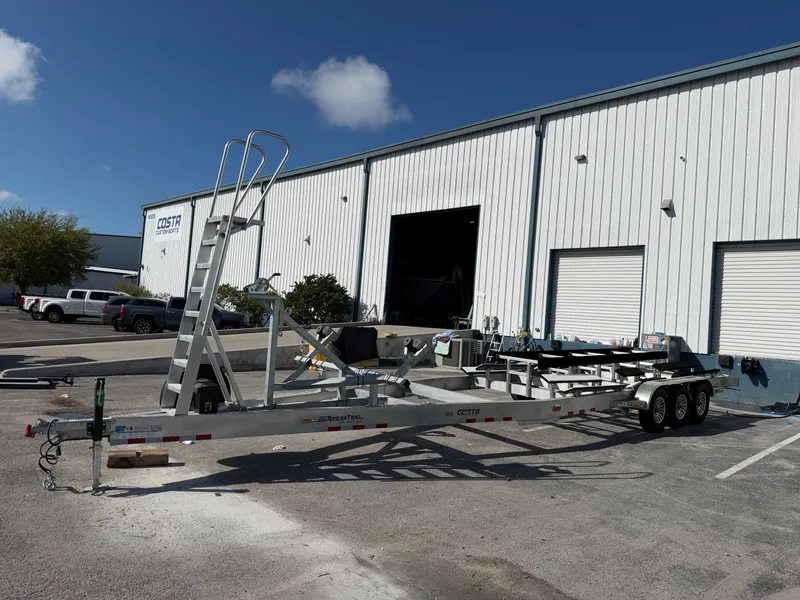 Slide: The Image of Costa Custom Boats 34 trailer outside workshop, 2025 model. - 4