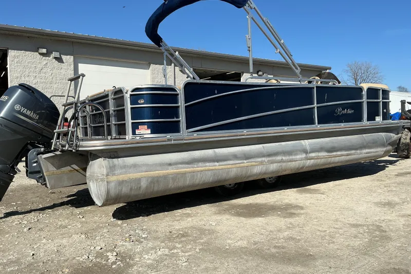 Slide: The Image of 2018 Berkshire 23RFC STS Fish pontoon boat with Yamaha motor, parked outdoors. - 3