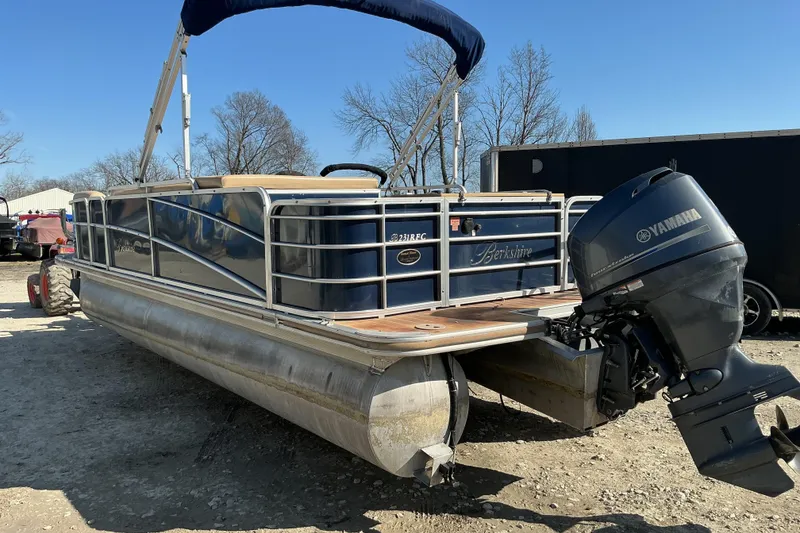 Slide: The Image of 2018 Berkshire 23RFC STS Fish pontoon boat with Yamaha outboard motor, parked outdoors. - 4