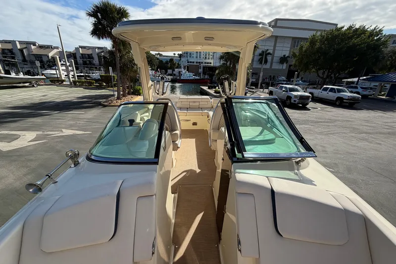 Slide: The Image of 2023 Chris-Craft Launch 28 GT boat interior with open deck and seating area. - 13