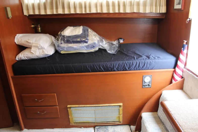 Slide: The Image of 1969 Pacemaker Tricabin interior with bed, pillows, and American flag decor. - 11