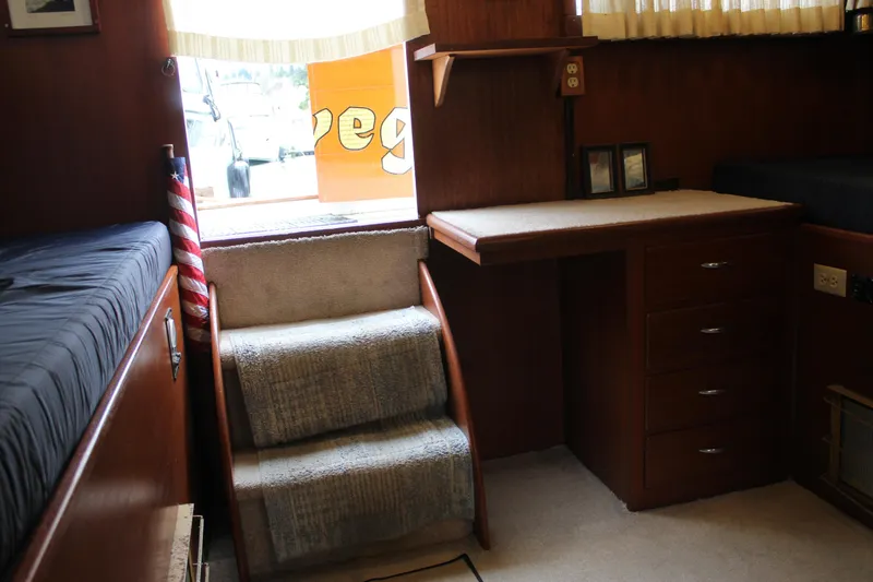 Slide: The Image of Interior of a 1969 Pacemaker Tricabin boat with stairs, desk, and bunk beds. - 13