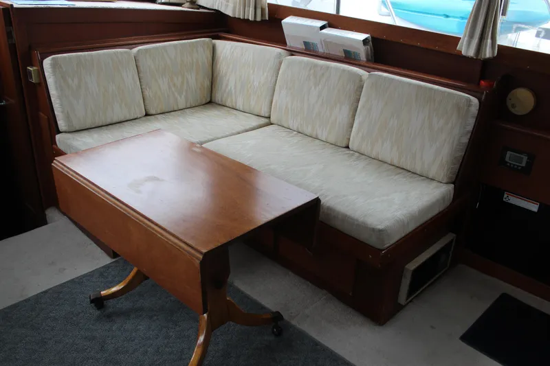 Slide: The Image of 1969 Pacemaker Tricabin interior with cushioned seating and wooden table. - 16