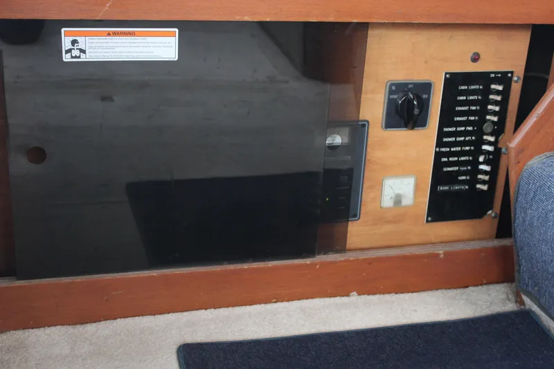 Slide: The Image of 1969 Pacemaker Tricabin control panel with switches and warning label. - 24