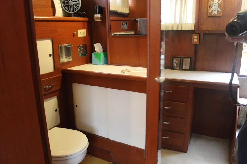 Slide: The Image of 1969 Pacemaker Tricabin interior with wooden cabinetry, sink, and toilet. - 9