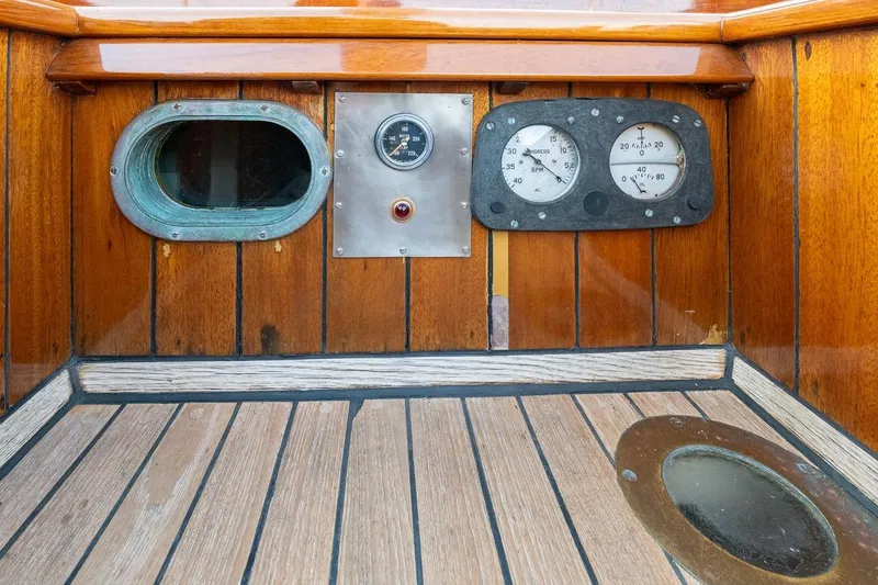 Slide: The Image of 1938 Philip Rhodes Cutter interior with vintage gauges and wooden paneling. - 21