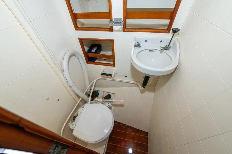 Slide: The Image of Compact bathroom in 1938 Philip Rhodes Cutter boat with sink and toilet. - 47