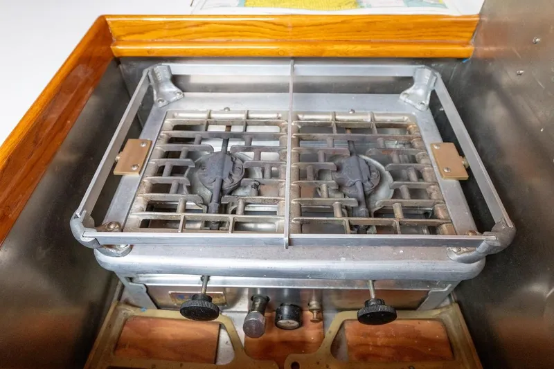 Slide: The Image of Vintage 1938 Philip Rhodes Cutter stove with dual burners and metal grates. - 55
