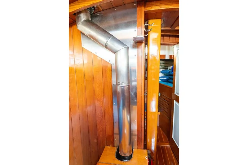 Slide: The Image of Interior of 1938 Philip Rhodes Cutter with wooden paneling and metal chimney. - 63