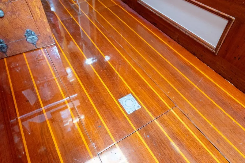 Slide: The Image of Polished wooden floor of 1938 Philip Rhodes Cutter boat interior. - 67