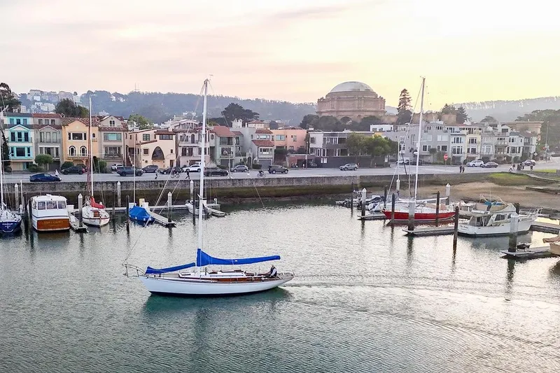 Slide: The Image of Sailboat in marina with colorful houses and dome building, Philip Rhodes Cutter, 1938. - 75