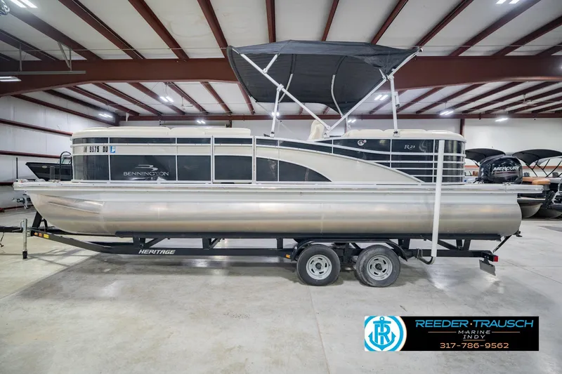 Slide: The Image of 2015 Bennington 2350 RSR pontoon boat on trailer in indoor showroom. - 11
