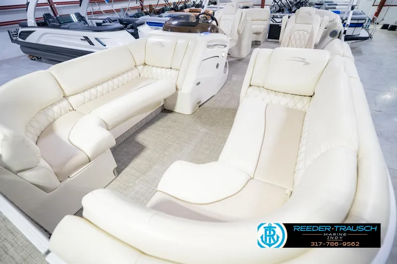 Slide: The Image of Luxurious interior of a 2015 Bennington 2350 RSR pontoon boat with plush seating. - 12