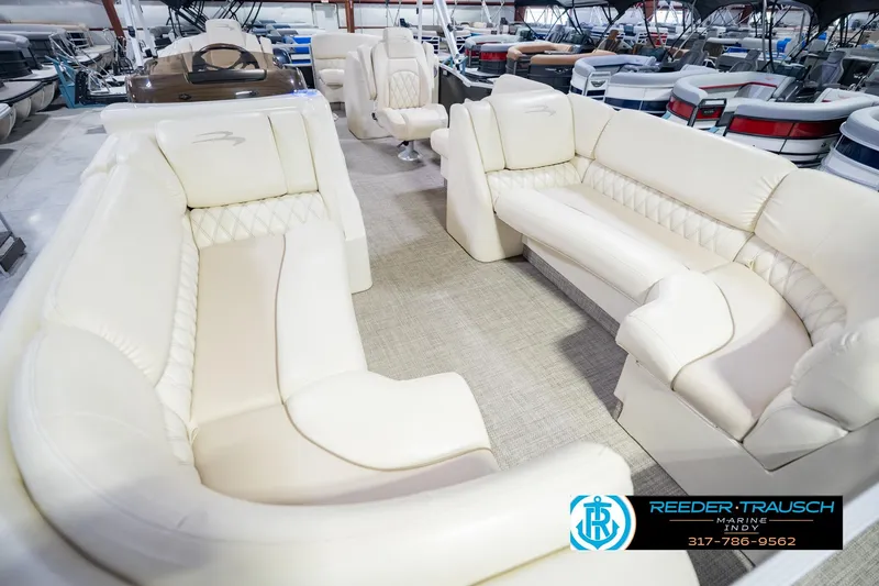 Slide: The Image of Luxurious interior of a 2015 Bennington 2350 RSR pontoon boat with plush seating. - 13