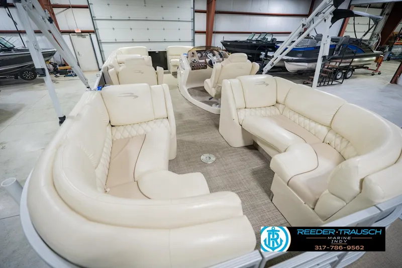 Slide: The Image of Interior view of a 2015 Bennington 2350 RSR pontoon boat with luxurious seating. - 15