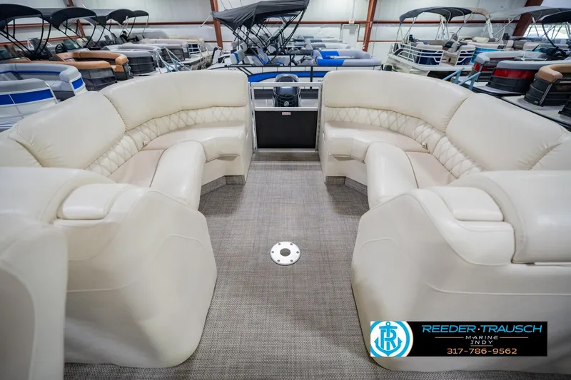 Slide: The Image of Luxurious seating on a 2015 Bennington 2350 RSR pontoon boat in a showroom. - 18