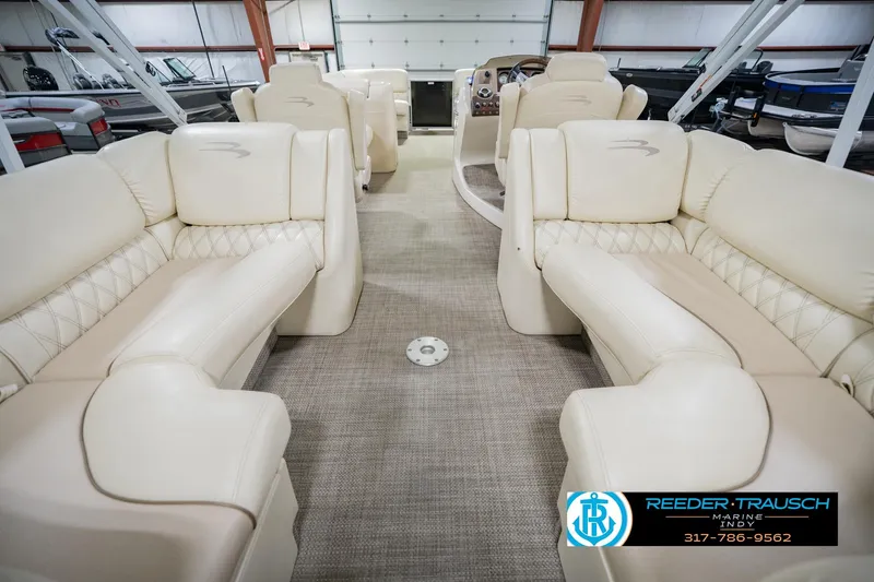 Slide: The Image of Luxurious interior of a 2015 Bennington 2350 RSR pontoon boat with plush seating. - 19