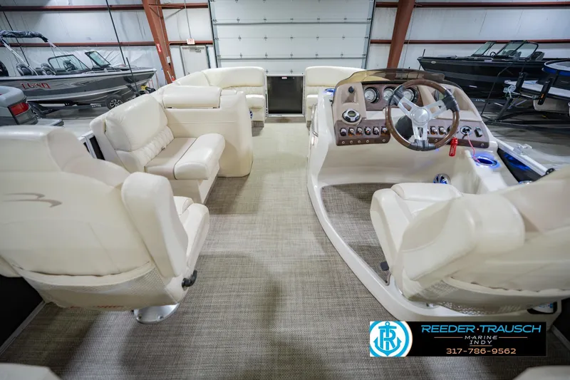 Slide: The Image of Interior view of a 2015 Bennington 2350 RSR pontoon boat with beige seating. - 20