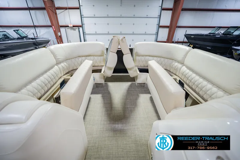 Slide: The Image of Luxurious interior of a 2015 Bennington 2350 RSR pontoon boat with plush seating. - 22