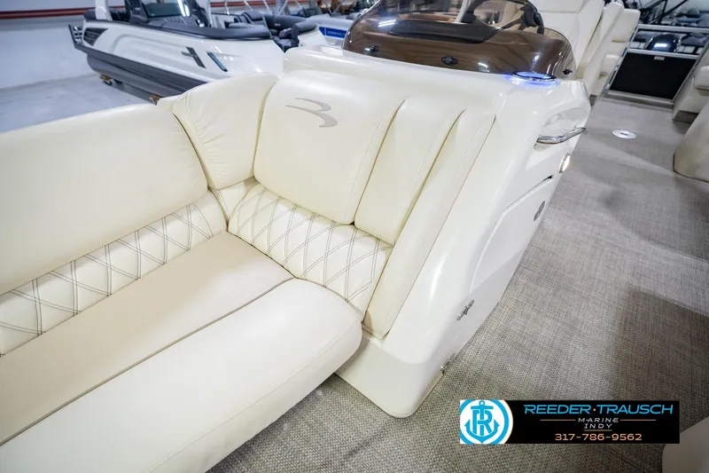 Slide: The Image of Luxurious seating on a 2015 Bennington 2350 RSR pontoon boat, featuring elegant upholstery. - 23