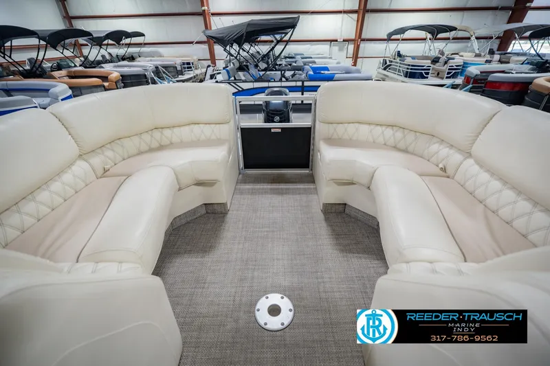 Slide: The Image of Luxurious interior of a 2015 Bennington 2350 RSR pontoon boat in showroom. - 29