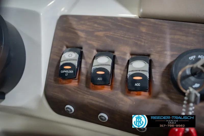 Slide: The Image of Control panel of a 2015 Bennington 2350 RSR boat with labeled switches. - 40