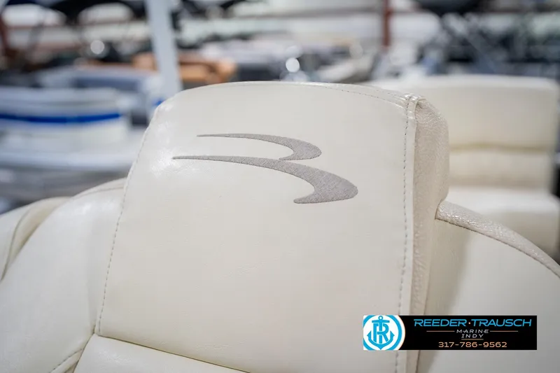 Slide: The Image of Close-up of 2015 Bennington 2350 RSR boat seat with logo, Reeder-Trausch Marine branding. - 43