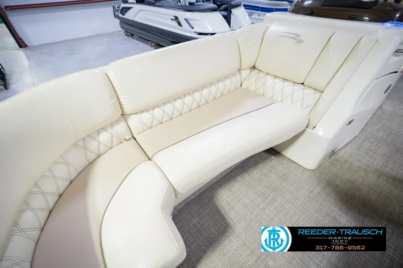 Slide: The Image of 2015 Bennington 2350 RSR boat interior with cream leather seating and diamond stitching. - 47