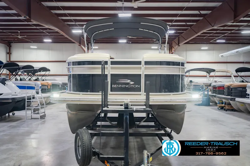 Slide: The Image of 2015 Bennington 2350 RSR pontoon boat in showroom, front view with canopy. - 5