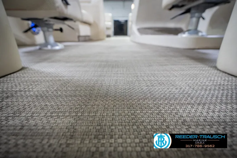 Slide: The Image of Interior view of 2015 Bennington 2350 RSR pontoon boat with textured flooring. - 51