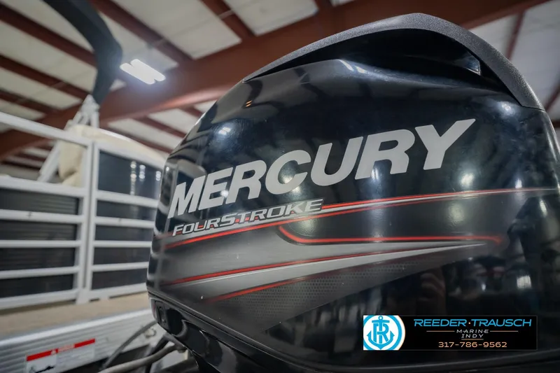 Slide: The Image of Mercury FourStroke engine on 2015 Bennington 2350 RSR boat in indoor setting. - 53