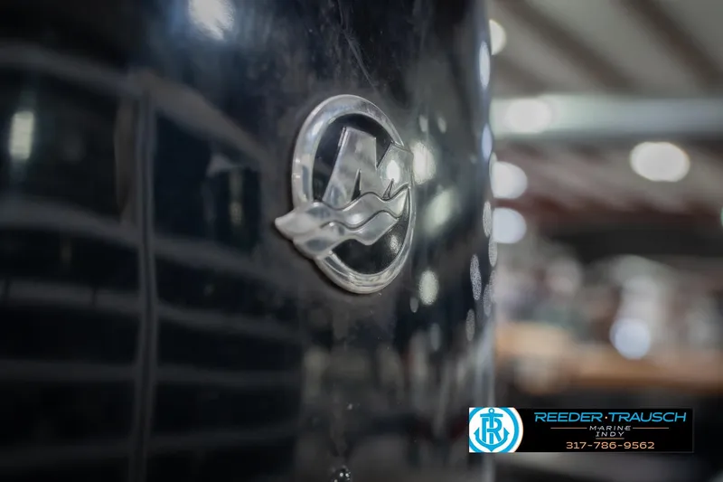 Slide: The Image of Close-up of a 2015 Bennington 2350 RSR boat emblem with Reeder-Trausch Marine logo. - 55